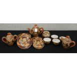 Japanese Satsuma earthenware part tea service decorated with figures and gilt highlights