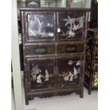 Chinese chinoiserie black lacquered cabinet, with applied soapstone and mother of pearl decorations,