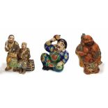 Japanese satsuma figural group of two gentleman seated, decorated with gilt highlights, 9" high,