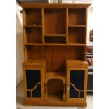 Pine dresser unit with raised shelved back over two blue glazed cupboard doors around a central