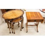 Nest of three walnut oval side tables, largest 23" high, on slender legs and ball and claw feet,