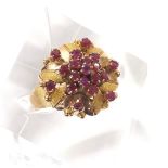 Yellow metal ruby set floral ring, 7.4gm, 18mm diameter, ring size P