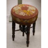 Victorian circular mahogany adjustable revolving music stool, with upholstered sea on four turned