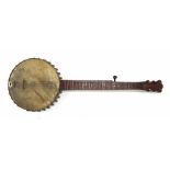 Old five string banjo by and stamped Manufactured by Lyon & Healy, Chicago, U.S.A. on the perch rod,