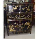 Decorative Chinese black lacquered cabinet, gilt decorated with birds in trees, 40" high, 32"