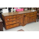 George III oak and mahogany crossbanded dresser base, with two banks of four drawers around a