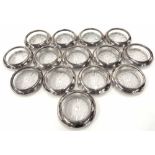 Fourteen Sterling silver mounted pressed glass wine coasters, circa 1960s, maker Frank M Whiting Co.