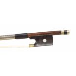 Nickel mounted violin bow bearing an illegible stamp, the stick round, the ebony frog inlaid with