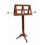 Arts & Crafts style mahogany duet adjustable music stand, fitted with two brass candle sconces on