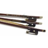 Two French nickel mounted violin bows, one stamped Pillot; also a half size nickel mounted violin