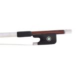 Silver mounted violin bow stamped Tourte, the stick round, the ebony frog inlaid with silver rings