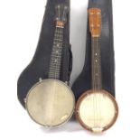 Early 20th century banjo branded Reliance to the head, case; together with another banjo ukulele