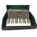 Hohner Verdi I piano accordion with forty-eight bass buttons, grey marble finish, case