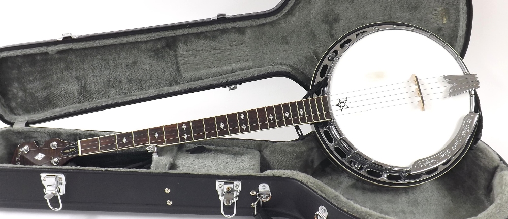 Gold Tone five string banjo, with highly polished inlaid resonator and geometric mother of pearl