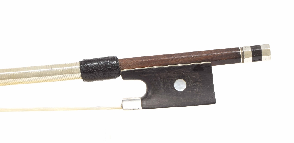 Silver mounted violin bow, unstamped, the stick round, the later ebony frog inlaid with pearl eyes