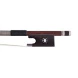 German silver mounted violin bow stamped Albert Nurnberger, the stick round, the ebony frog inlaid