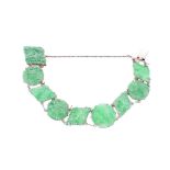 18k white gold and green jade link bracelet set with alternating pierced circular and lozenge links,