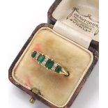 Antique 18ct emerald and diamond ring, Birmingham 1906, with four oval emeralds and six small old-