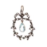 Antique aquamarine and rose diamond pendant, with a single aquamarine in a wreath bowed diamond