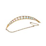 Attractive 9ct crescent brooch set with fifteen graduated opals, with safety chain, 6.6gm, 71mm