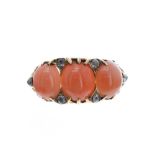 18ct claw claw coral and diamond ring in a carved setting, band width 10mm, 5.7gm, ring size M