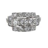 Good platinum Art Deco style diamond set dress ring, with round brilliant-cut diamonds in a