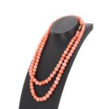 Coral bead necklace with 14k clasp, beads 7mm approx, 45.7gm, 30" long