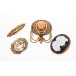 Oval mourning target brooch set with a single cabouchon coral stone, 25gm, 38mm wide approx; also