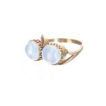 Yellow metal twist ring set with two cabouchon moonstones, each stone 9mm, 5.1gm, ring size Q/R,