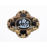 Victorian agate and enamel cruciform mourning brooch, the centre enamelled with a spray of flowers