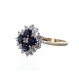 18ct sapphire and diamond cluster ring, with four sapphires in a surround of round brilliant-cut