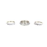 9ct eternity ring set with white stones; also an 18ct and platinum five stone ring (one missing) and