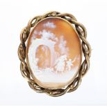 Oval cameo brooch carved with figures in a Classical rural setting and within an open twist