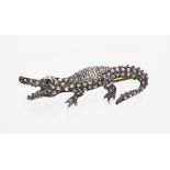 Novelty brooch modelled as a crocodile with sapphire set eye and diamond encrusted body, 4.9gm, 45mm