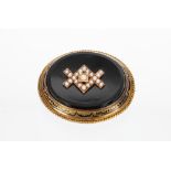 Victorian onyx and seed pearl set oval mourning brooch, 25.9gm, 48mm wide overall approx