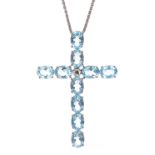 Impressive 18k white gold topaz cross pendant, consisting of ten oval pale blue topaz, each 1.00ct