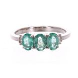 9k white gold emerald and diamond trilogy ring, band width 6mm, 3gm, ring size P