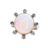 Large cabouchon opal and diamond dress ring, the opal surrounded by eight small diamonds, 9ct ,