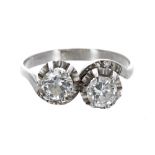 Platinum two stone diamond crossover ring, round brilliant-cuts, each 0.65ct approx, clarity SI1-