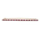 Attractive ruby and diamond bar brooch in yellow gold, 5.1gm, 72mm wide