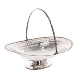 Victorian oval pierced silver cake basket with swing handle over, maker Martin Hall & Co,