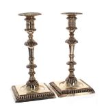 Pair of George II silver candlesicks on square reeded bases, maker Thomas Whipham & Charles