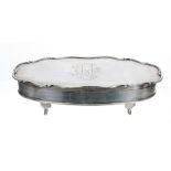 Edwardian oval silver trinket box, the monogrammed lid with scrolling rim, maker William Hutton &