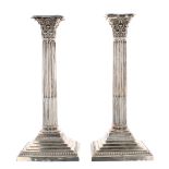 Pair of late Victorian silver Corinthian column candlesticks, with cast capitals over cylindrical