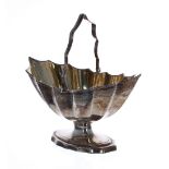 George III silver sugar basket, with fluted shaped panels and a reeded swing handle over, maker