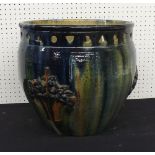 Large pottery, drip glaze jardiniere, with pierced rim and applied moulded baskets of flowers