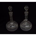 Pair of cut glass globular shape decanters and stoppers, 11.5" high (2)