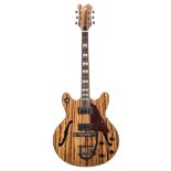 Skylark hollow body electric guitar; Finish: natural zebra wood; Fretboard: rosewood; Frets: good;