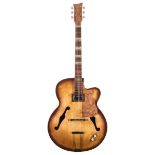 1950s archtop guitar with various modifications including humbucker neck pickup and associated