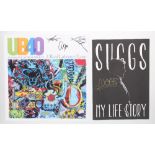 UB40 - autographed 'A Real Labour of Love' 12" x 12" poster; together with Suggs - autographed 'My